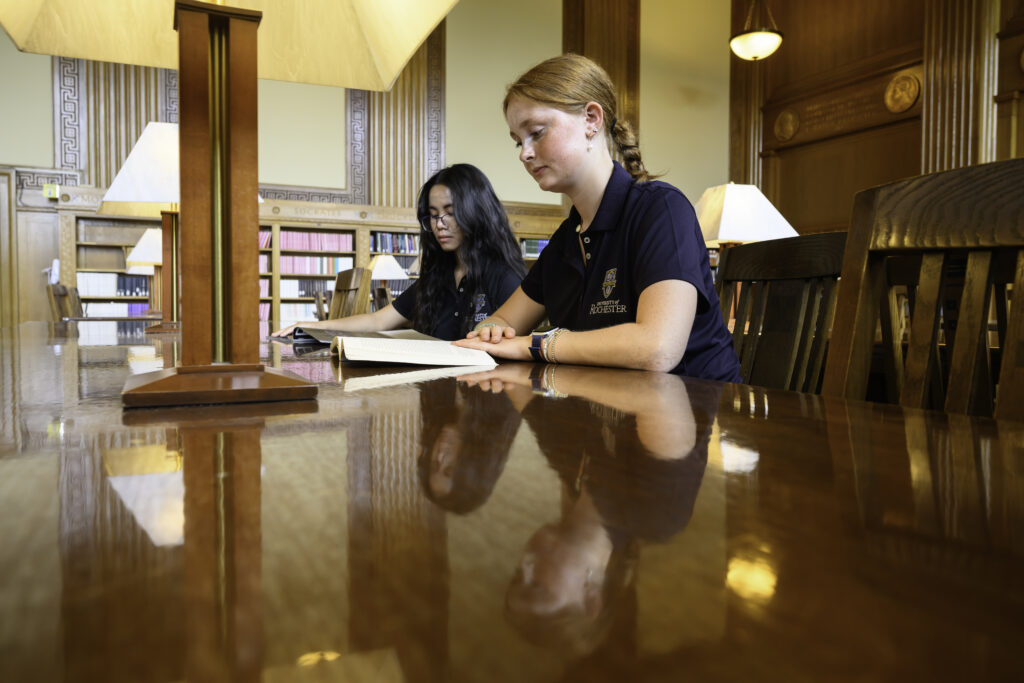 Two students study in the Periodical Reading Room in Rush Rhees Library.