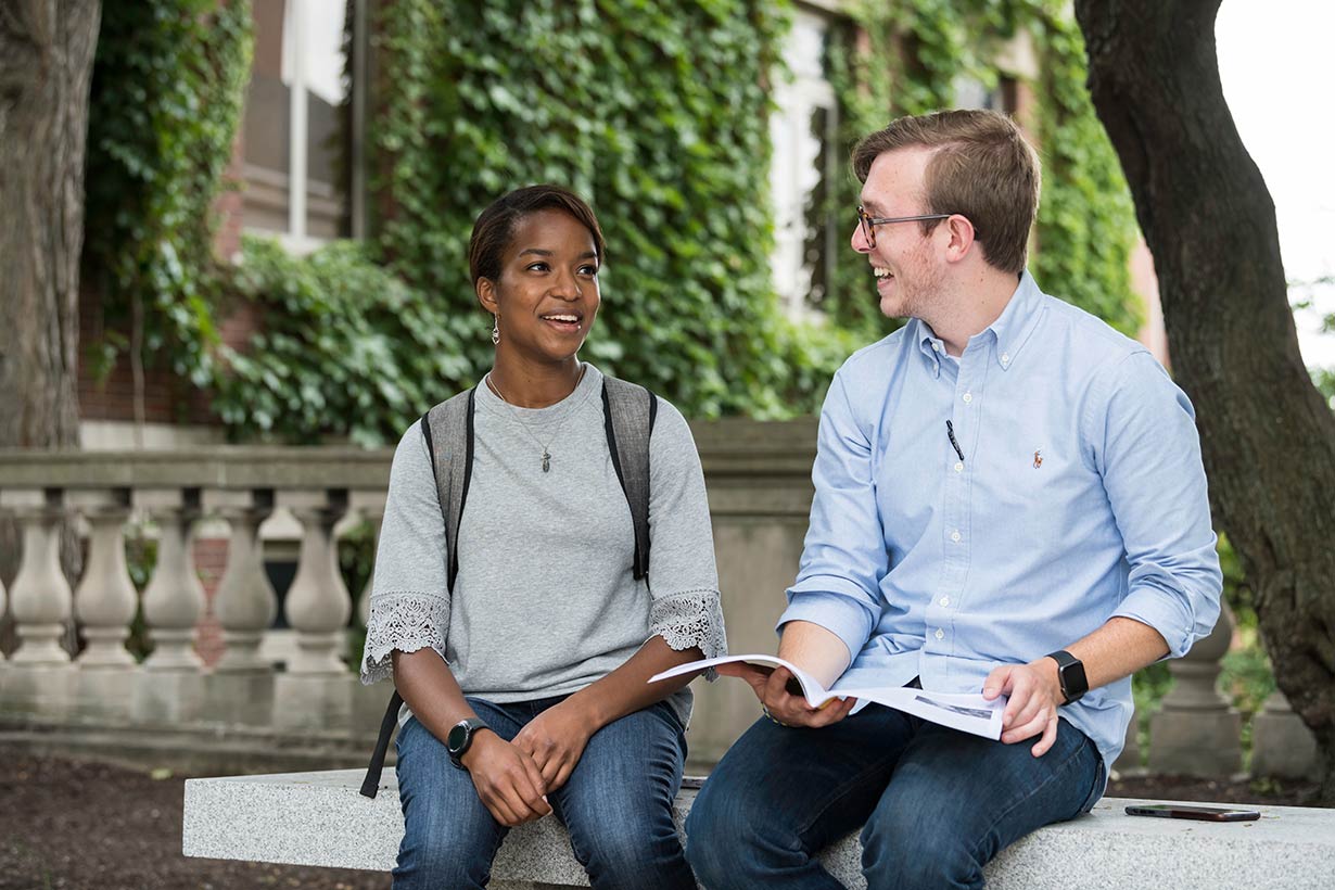 A prospective student meeting with an admissions counselor on campus.