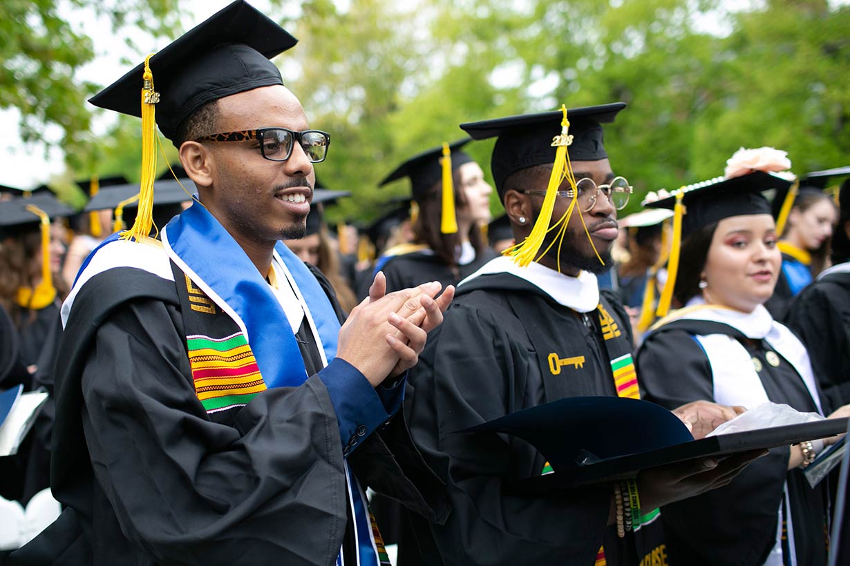 Students in cap and gown at commencement.