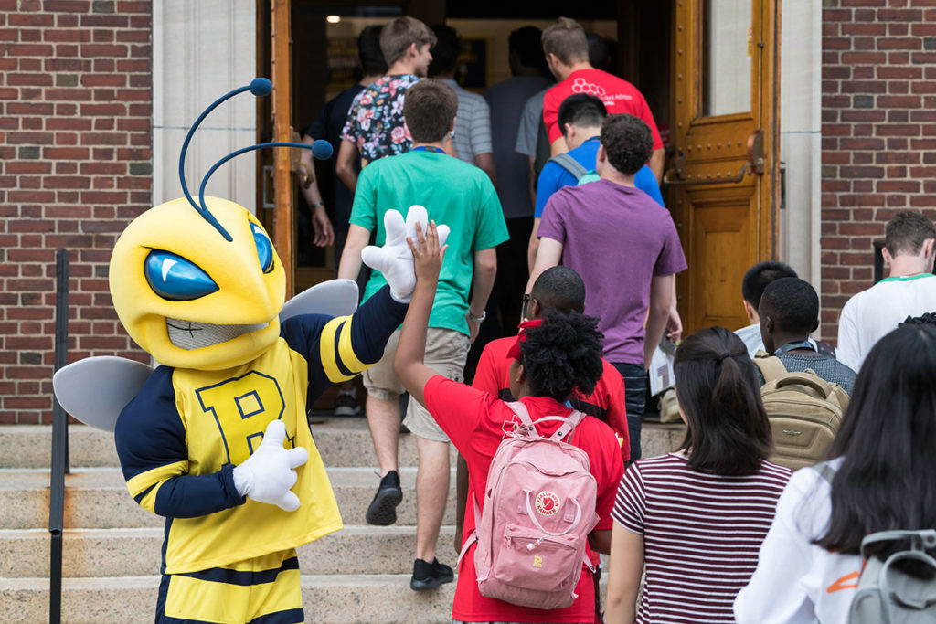 A group of students entering a building.