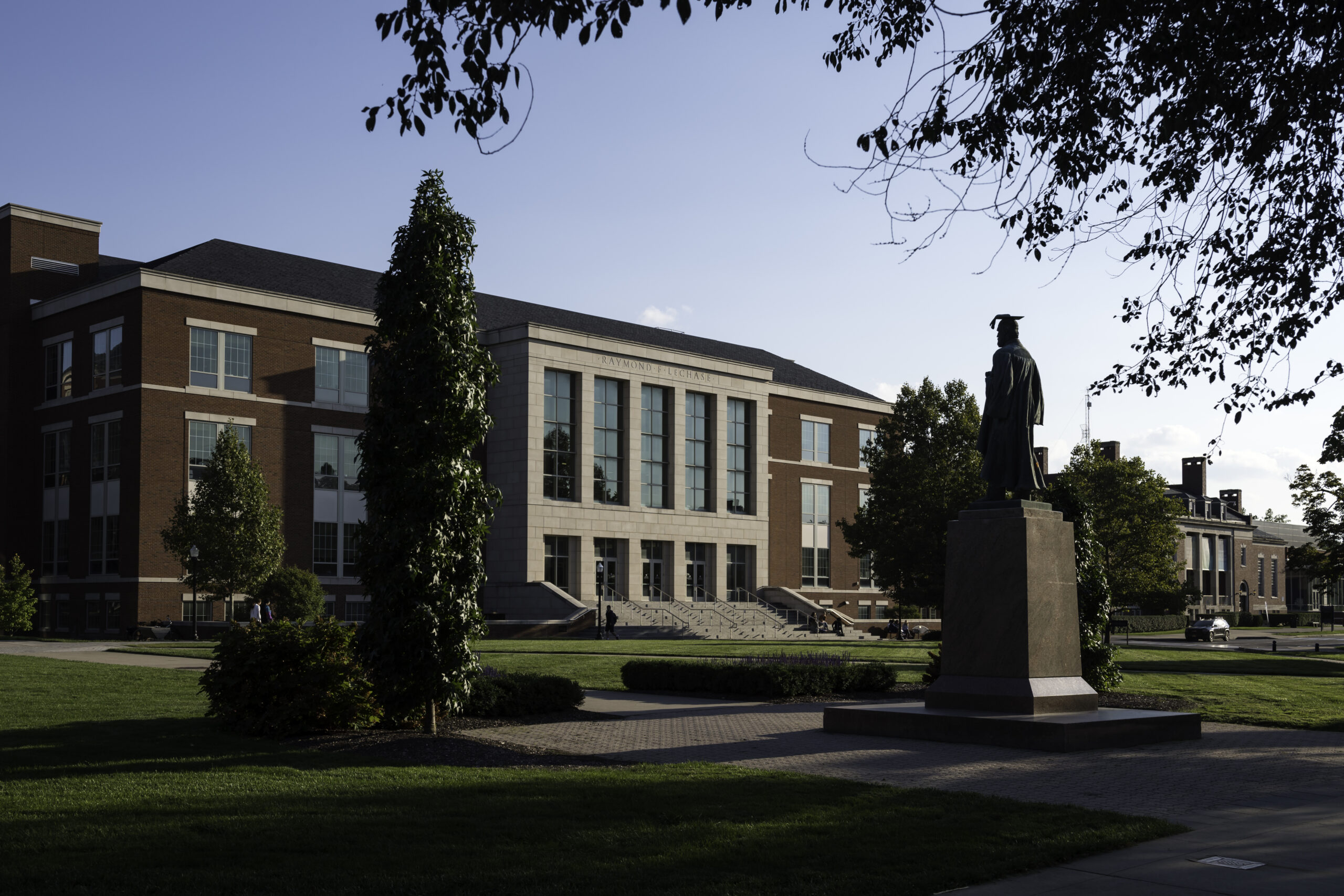 Students are pictured on the steps of LeChase Hall, home of the Warner School of Education near Wilson Quad.